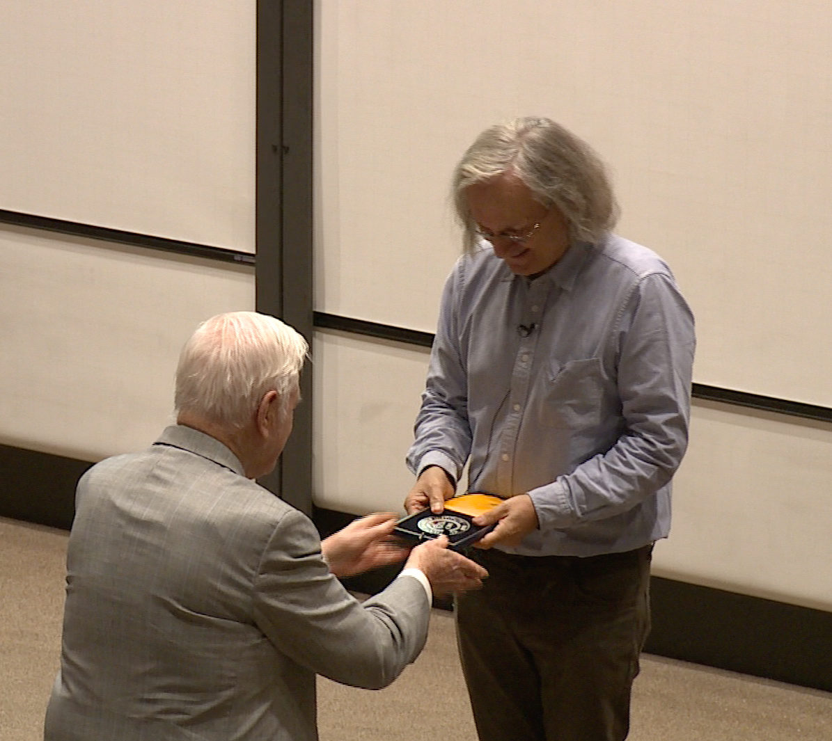 Landon Clay presenting the award to Etienne Ghys